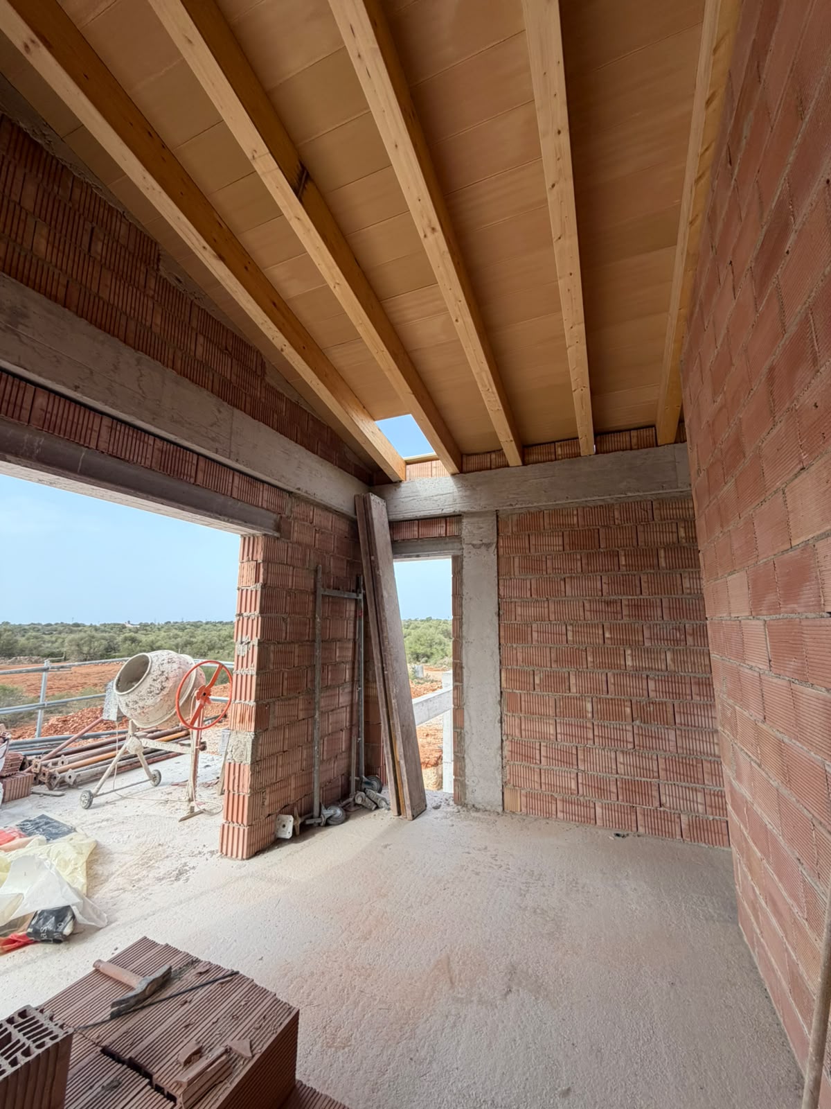 Timber roof structure with closed boarding above the upper floor