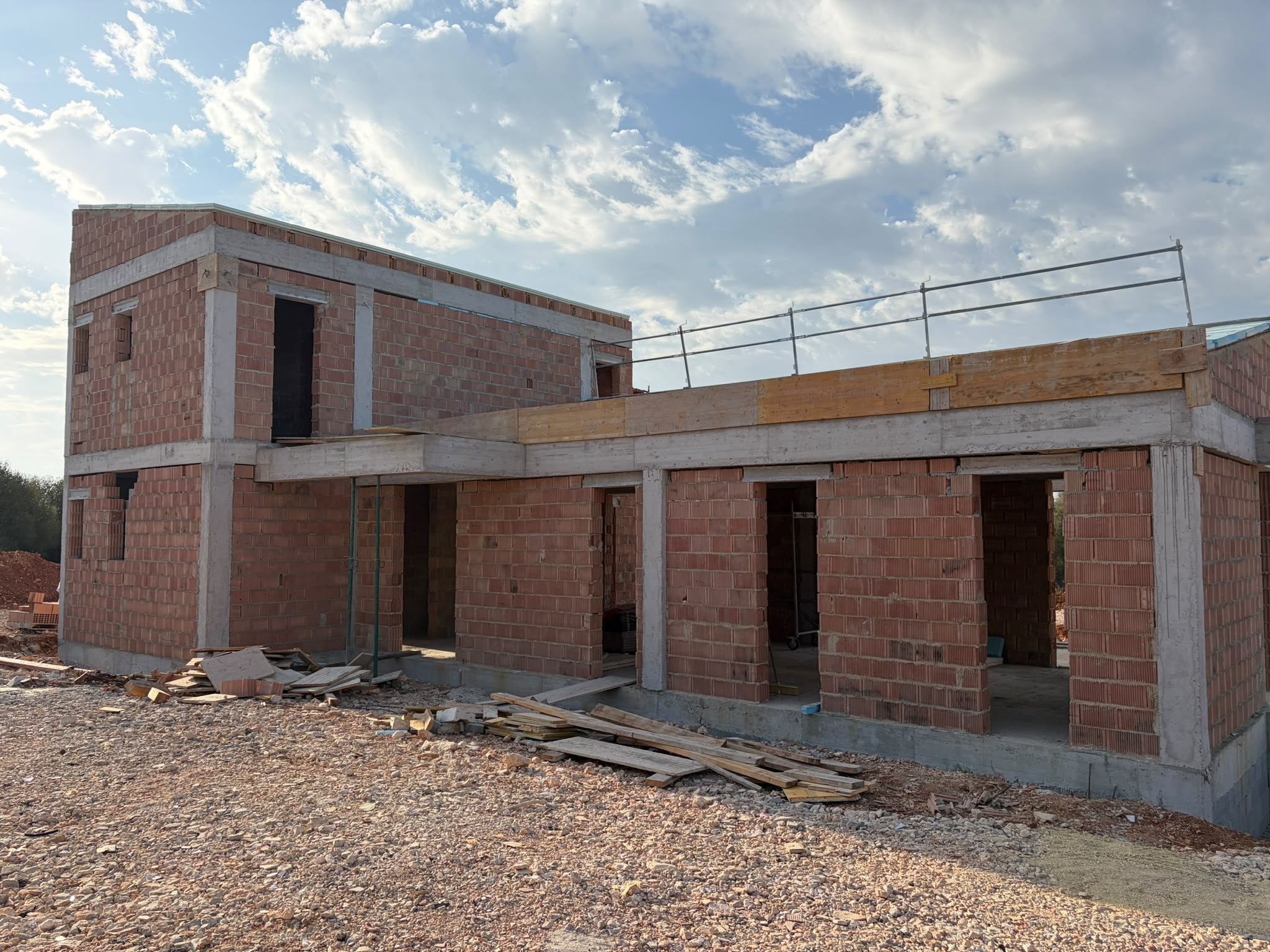The complete shell of Finca Son Gorem II with its roof, August 2026